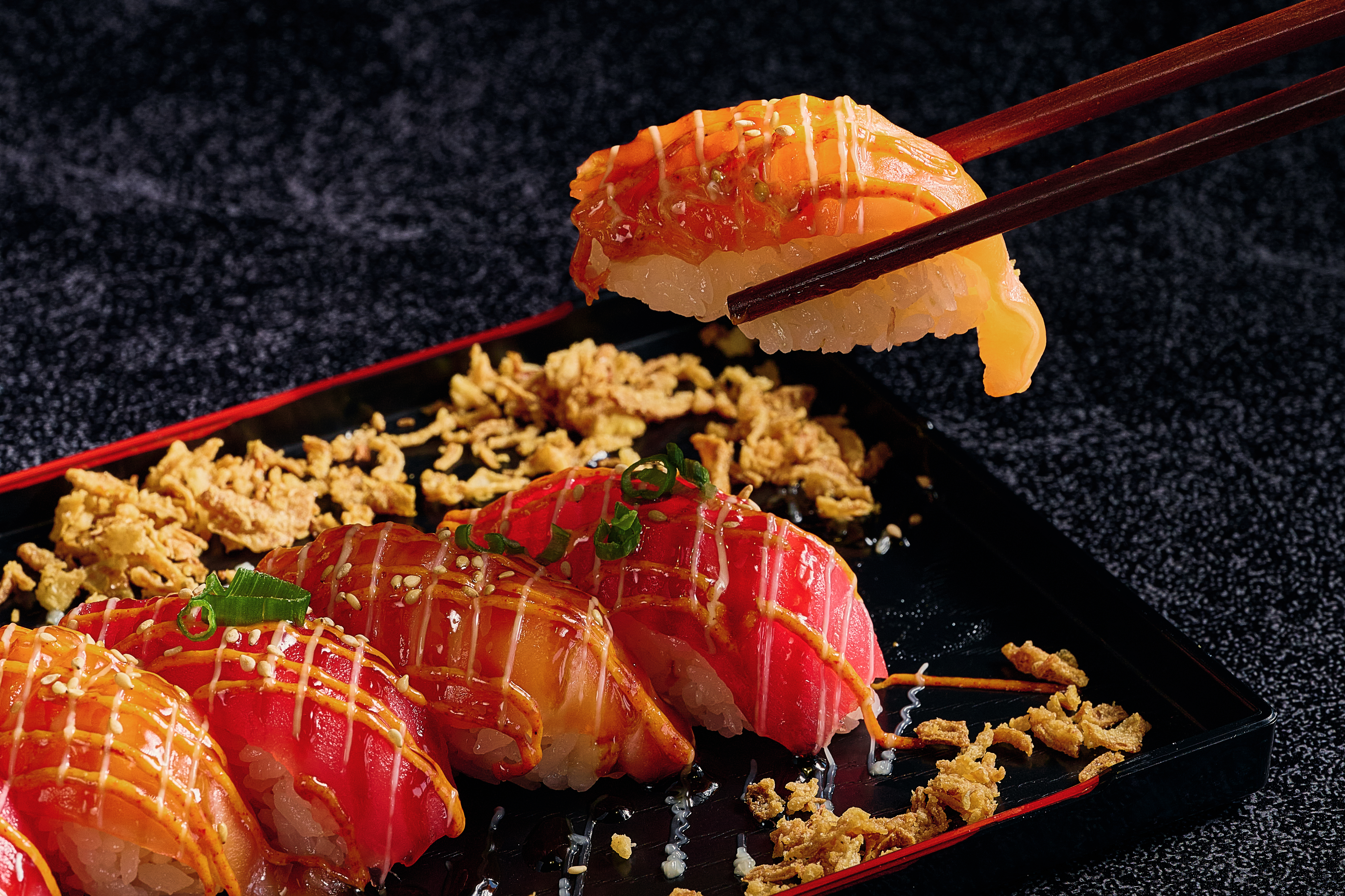 Assorted sushi rolls on a white plate