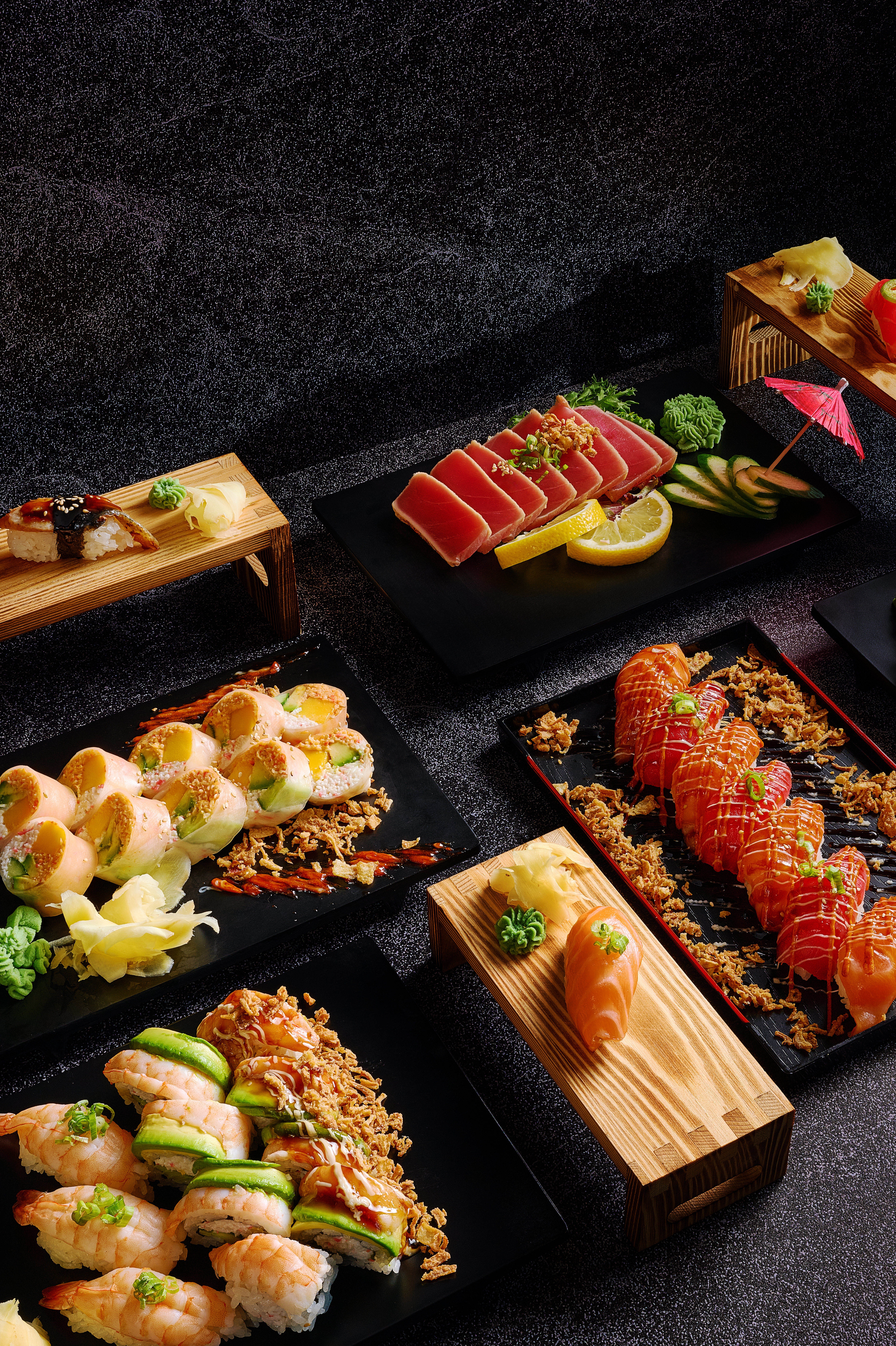 Fresh sushi and fish prepared on a wooden board